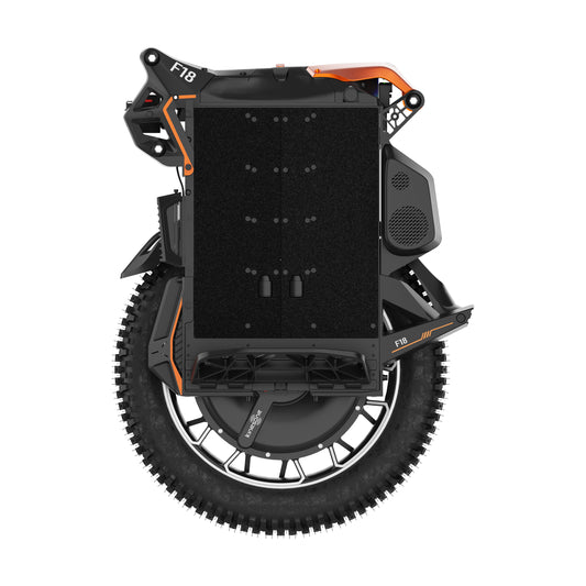 Top-down view of a black and orange electric unicycle with an off-road tyre, black textured central panel, and visible F18 branding on the frame.